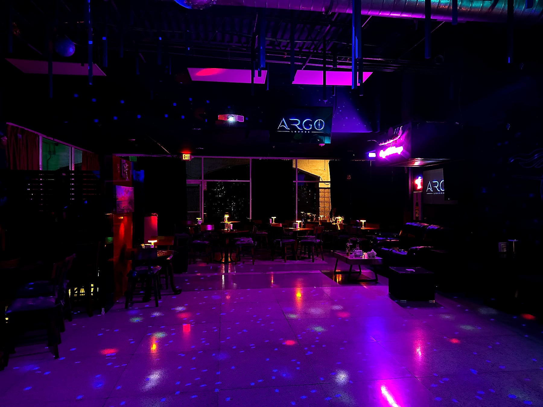 The Argo Lounge dance floor and lounge washed in purple light at night